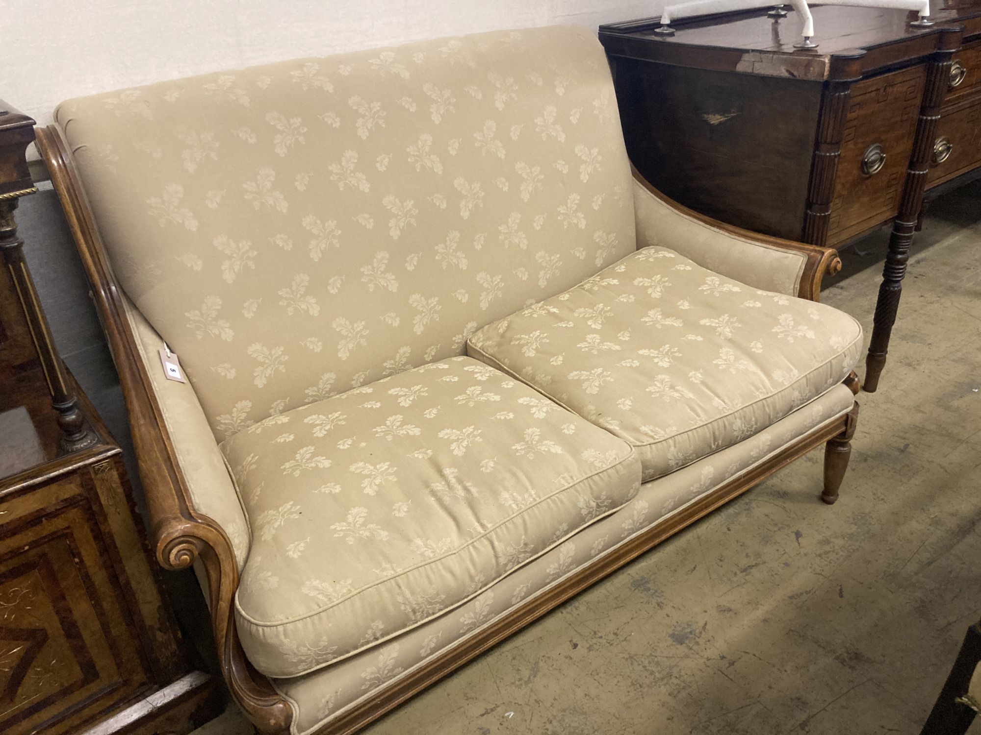 A Wesley Barrell beech two seater settee, width 140cm depth 84cm height 96cm